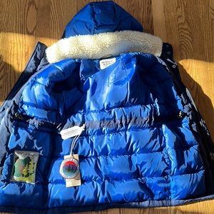 Blue coat, white fur in the inside. Boy sizing 8-10 years old. Brand new.
